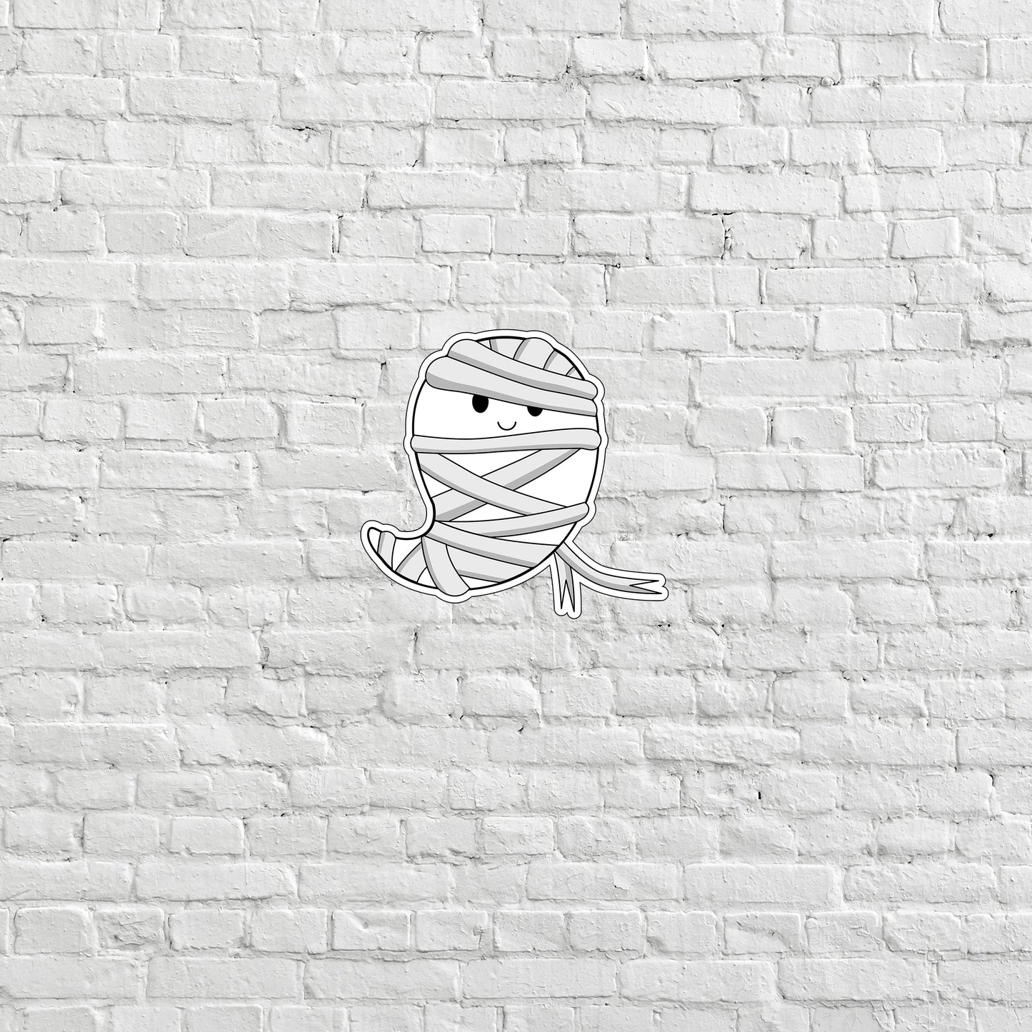 a drawing of a wrapped up ball of yarn on a brick wall