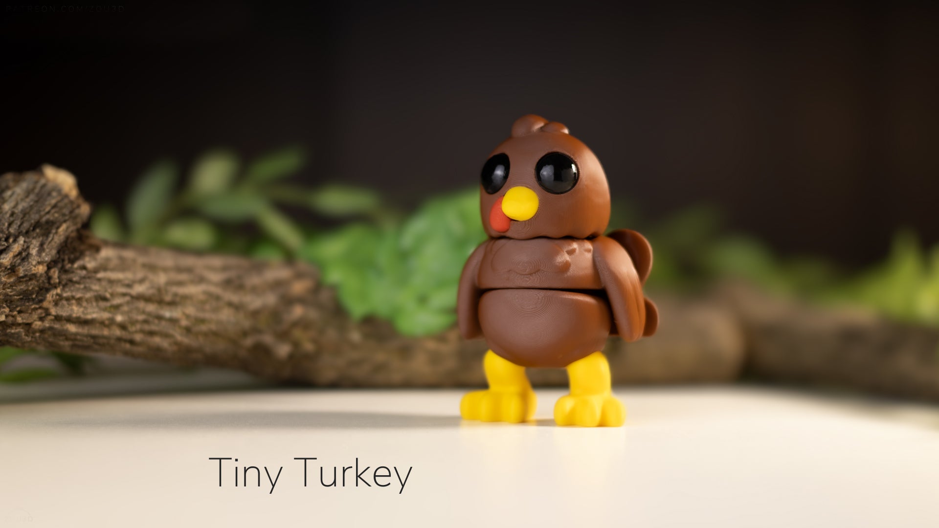 a tiny toy turkey sitting on top of a table