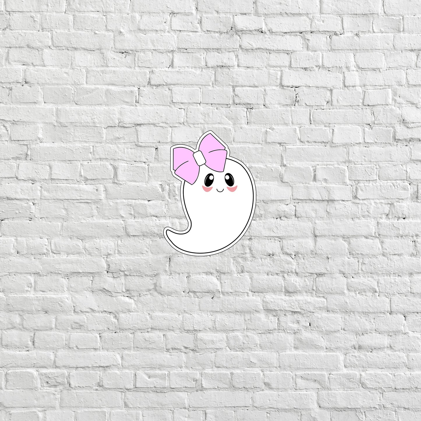 a white brick wall with a pink bow on it