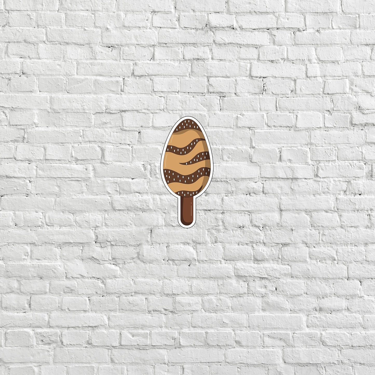 a white brick wall with an ice cream sticker on it