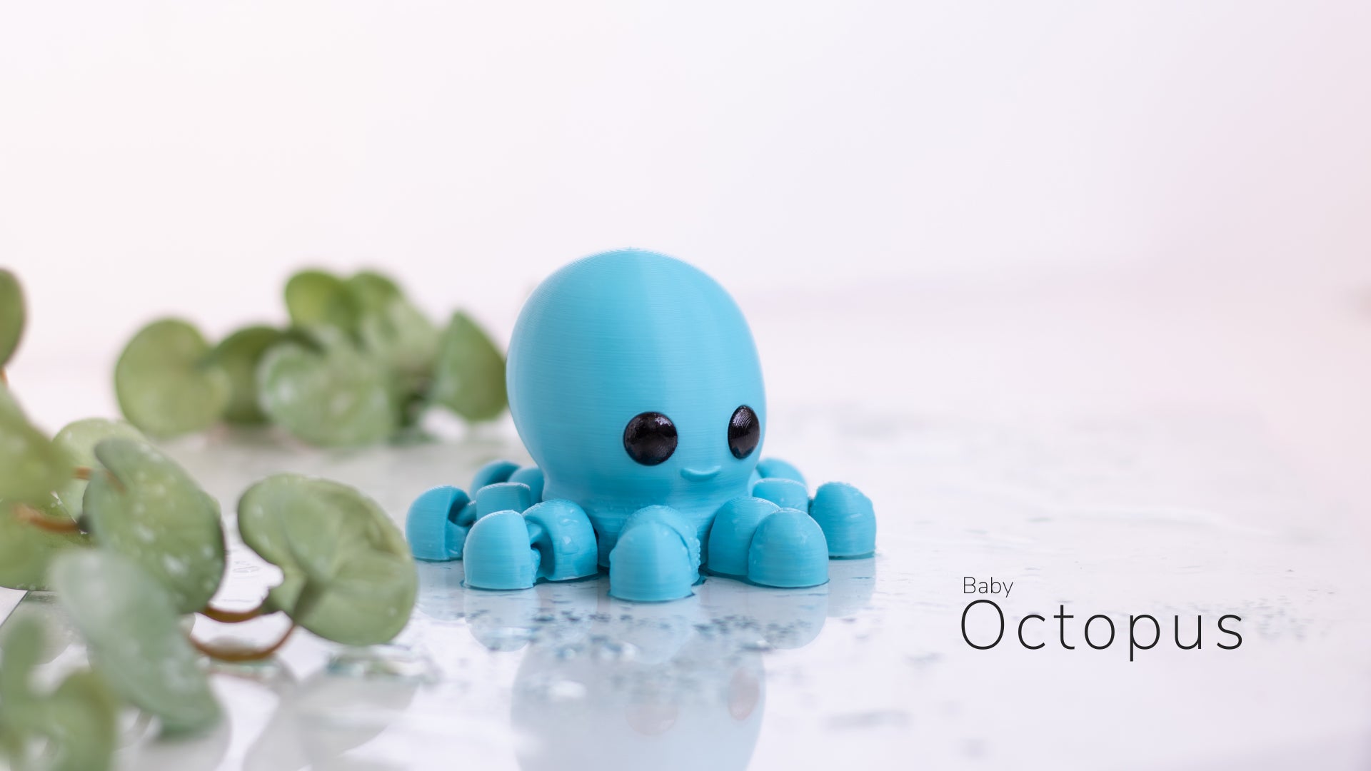 a blue toy octopus sitting on top of a table