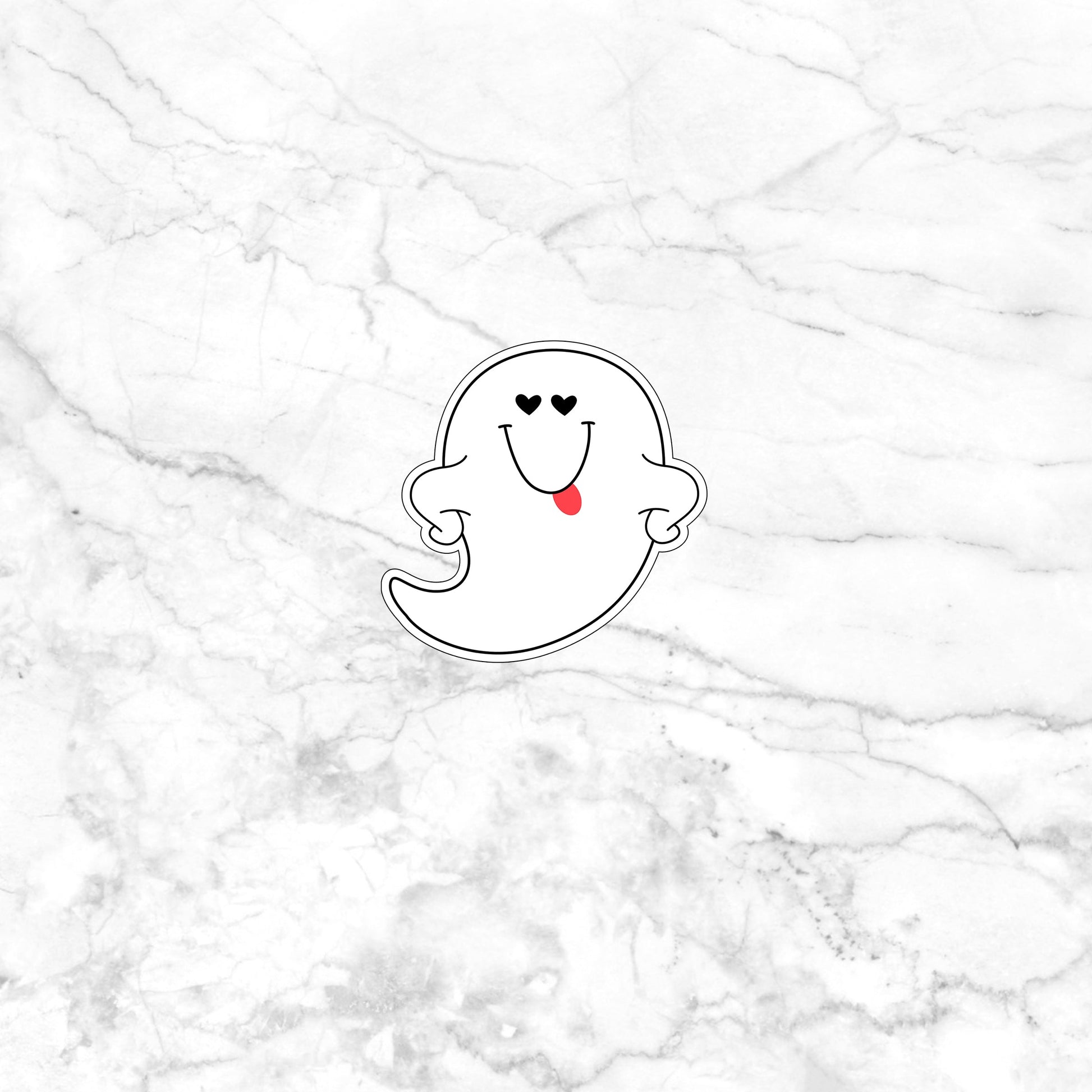 a sticker of a ghost on a marble surface