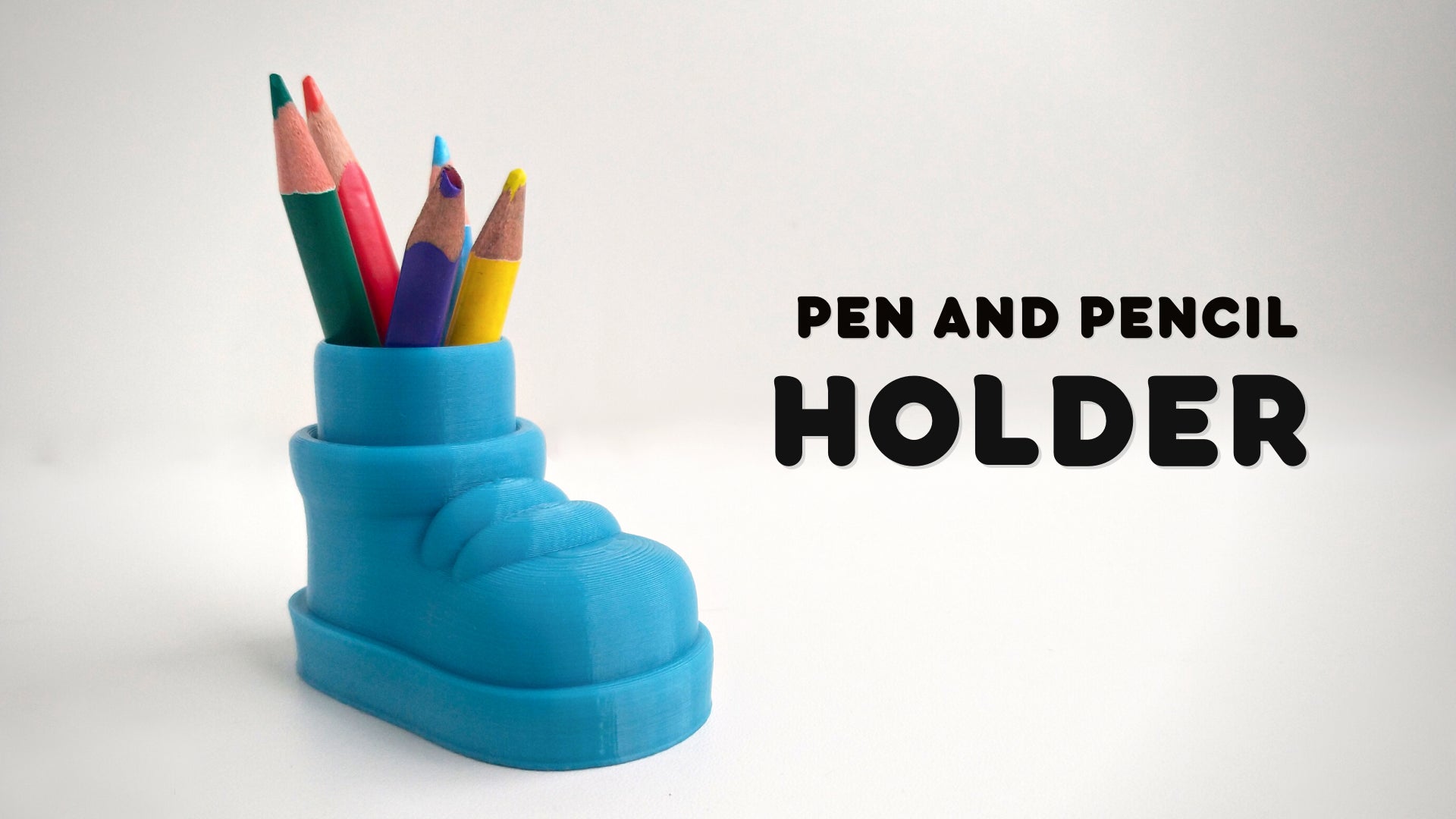 a pen and pencil holder with colored pencils in it