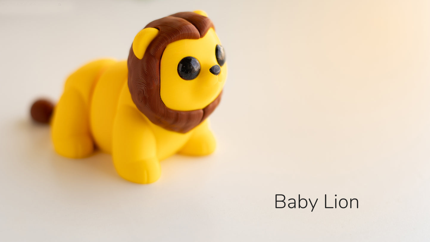 a yellow lion toy sitting on top of a white table