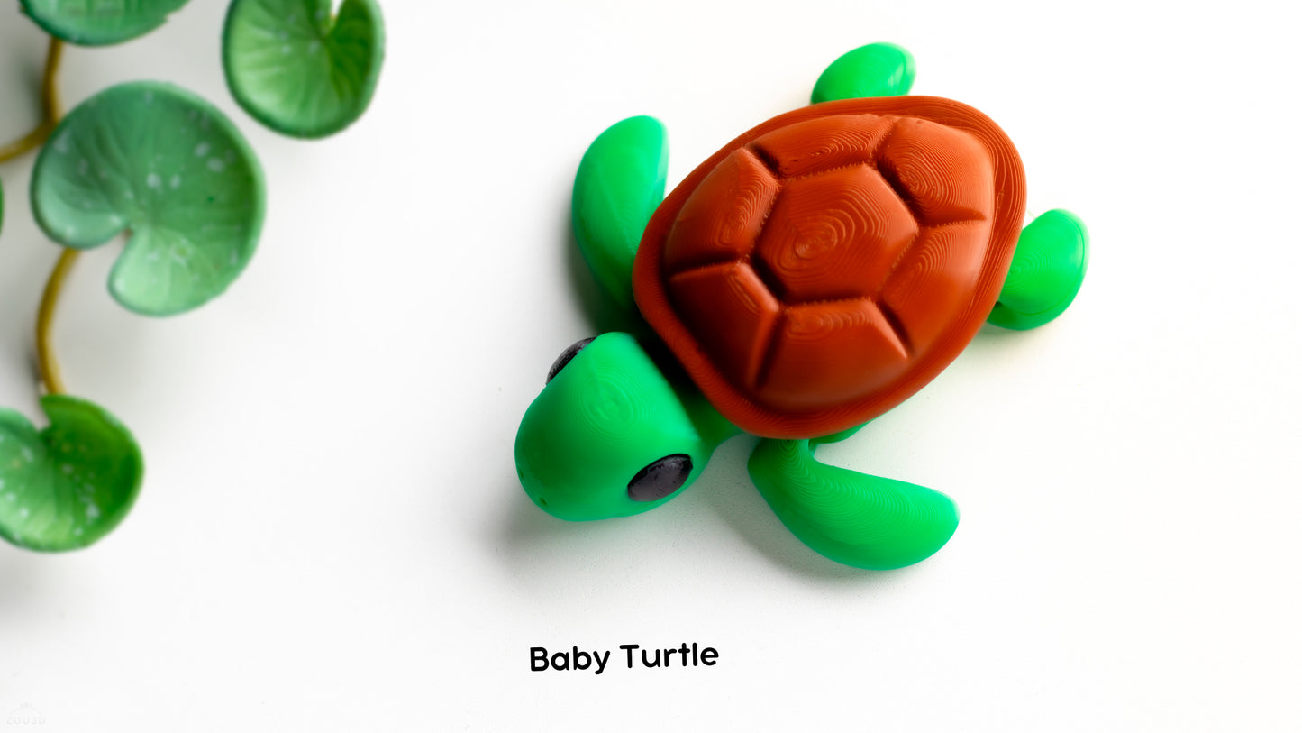 a toy turtle sitting on top of a white surface