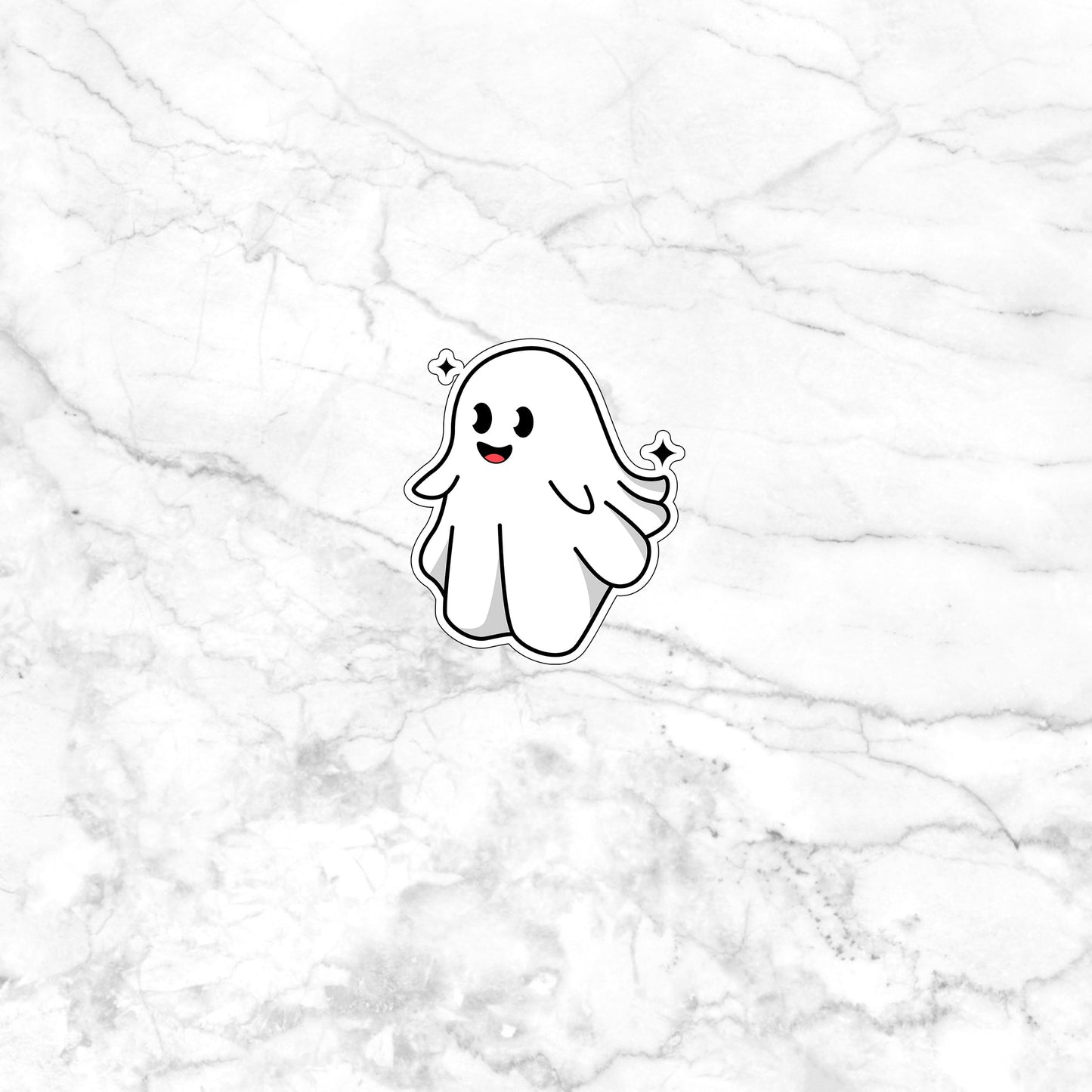 a sticker of a ghost on a marble surface