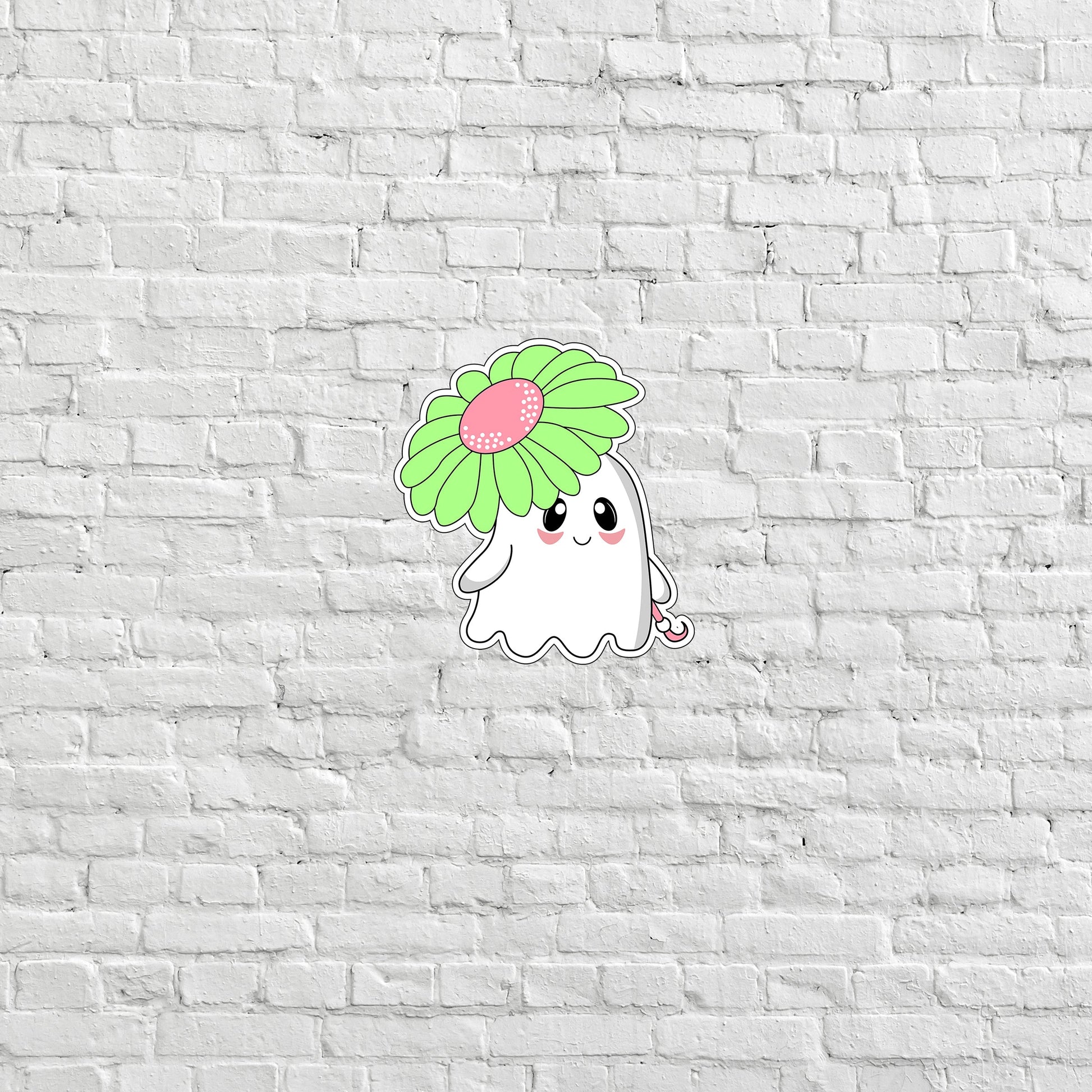 a white brick wall with a sticker of a ghost holding a flower