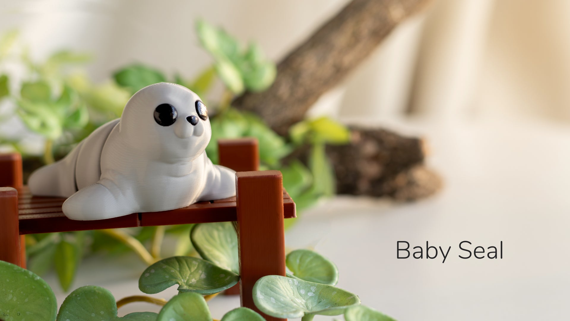 a baby seal is sitting on a bench