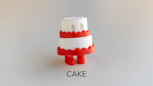 a red and white cake is on a white surface