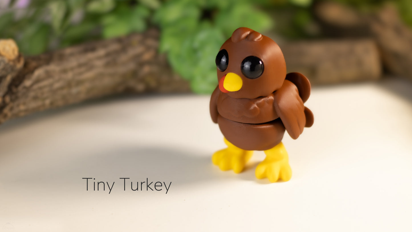 a small toy bird sitting on top of a table