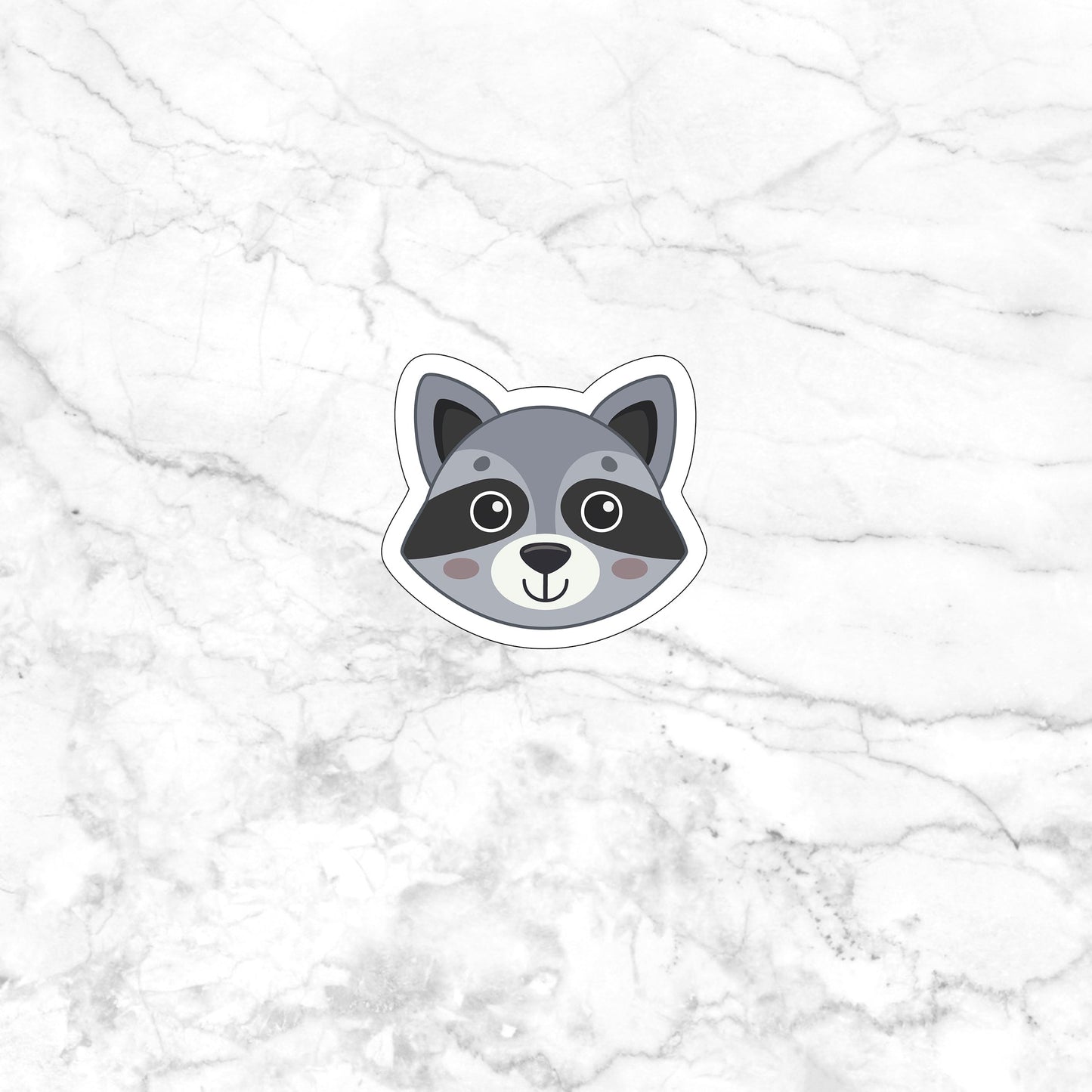 a sticker of a raccoon on a marble surface