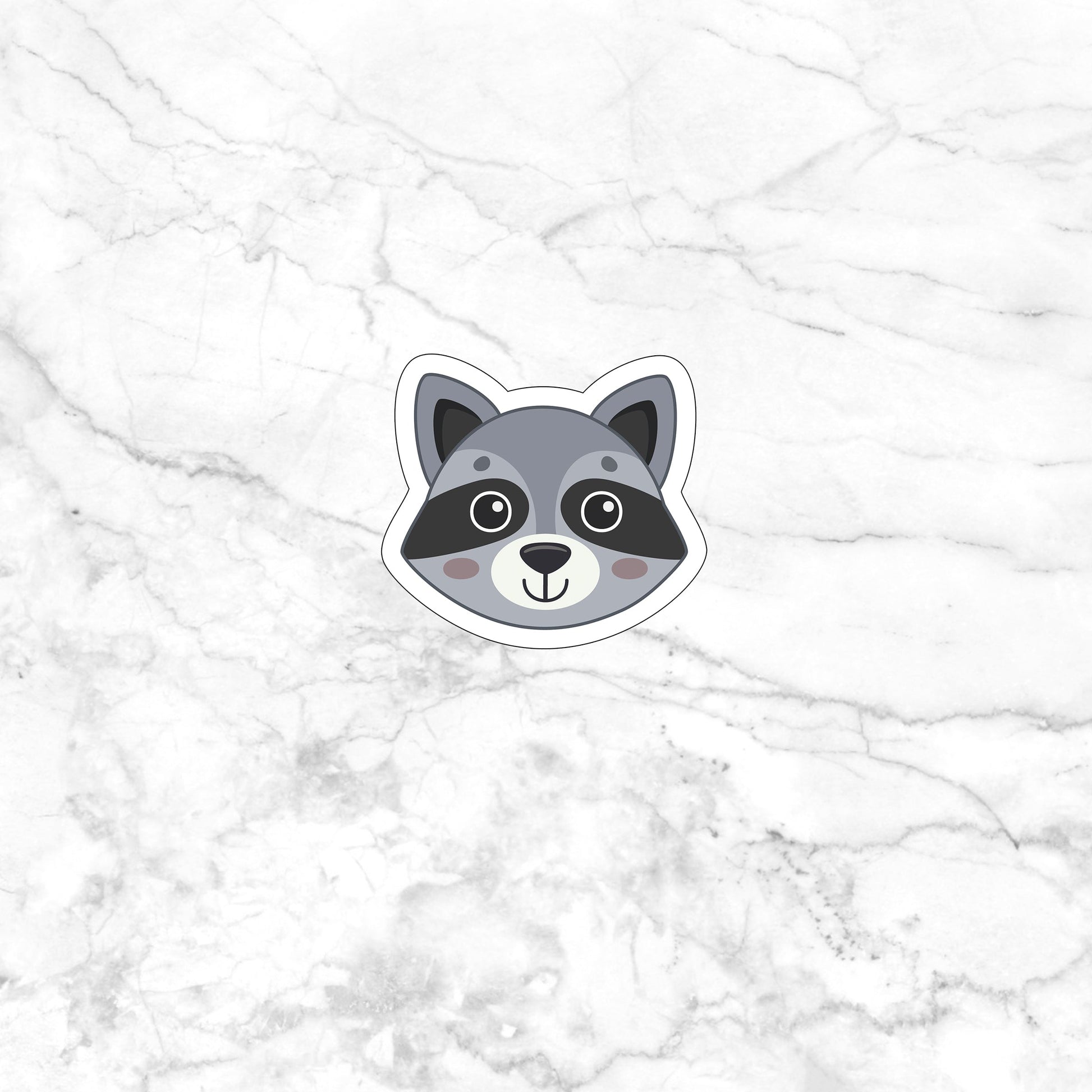 a sticker of a raccoon on a marble surface