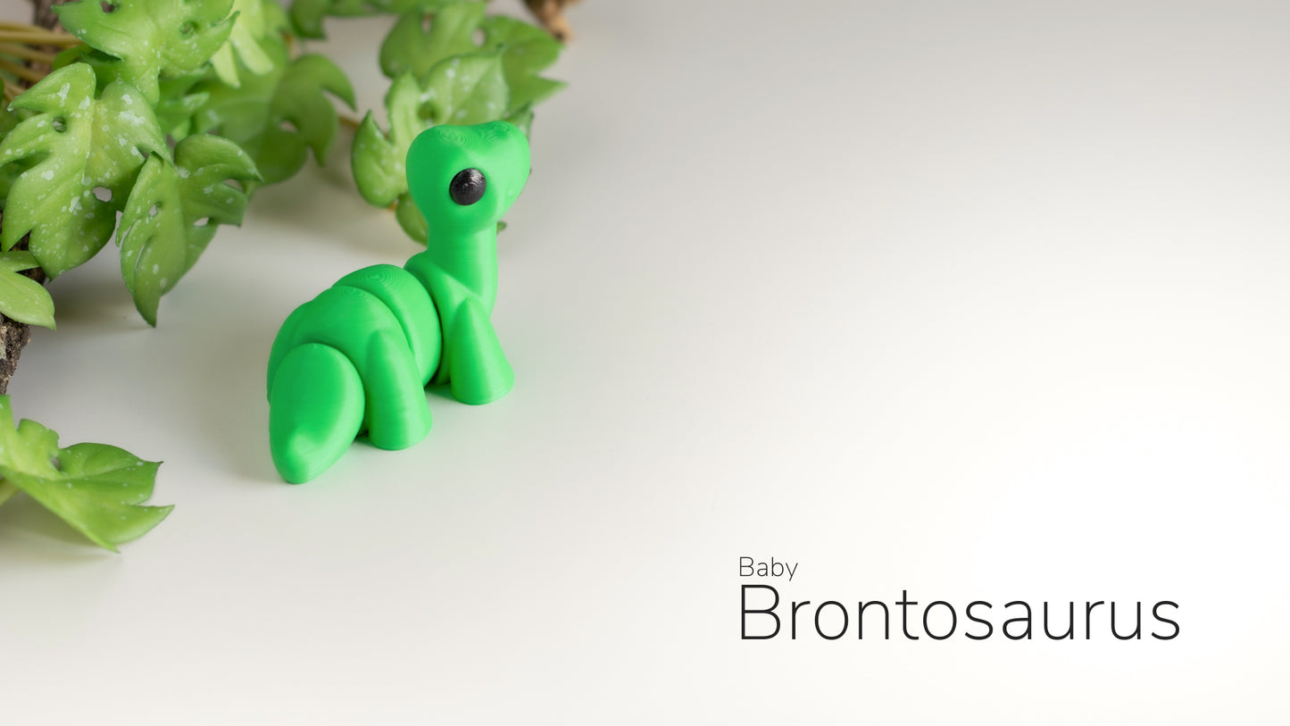 a green toy sitting on top of a white table