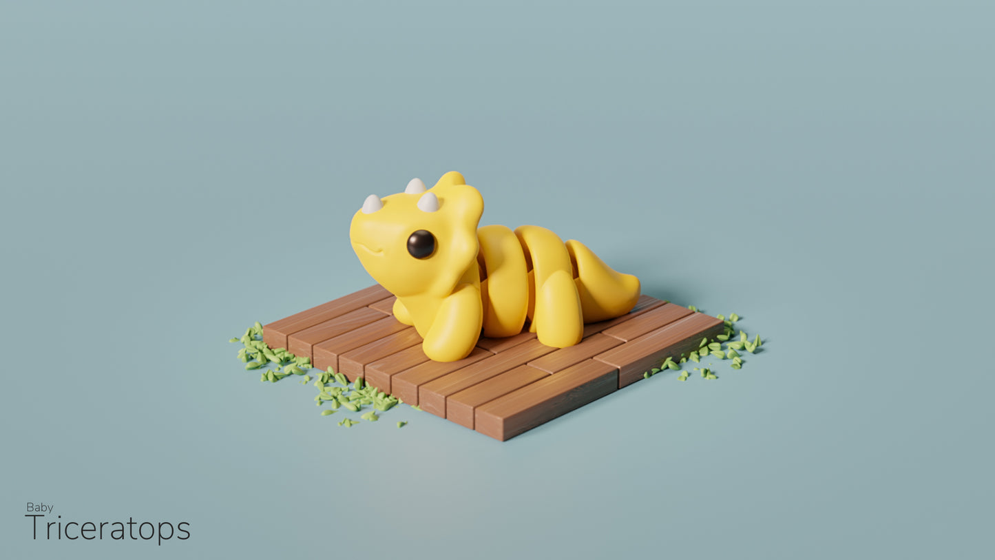 a yellow toy laying on top of a wooden platform