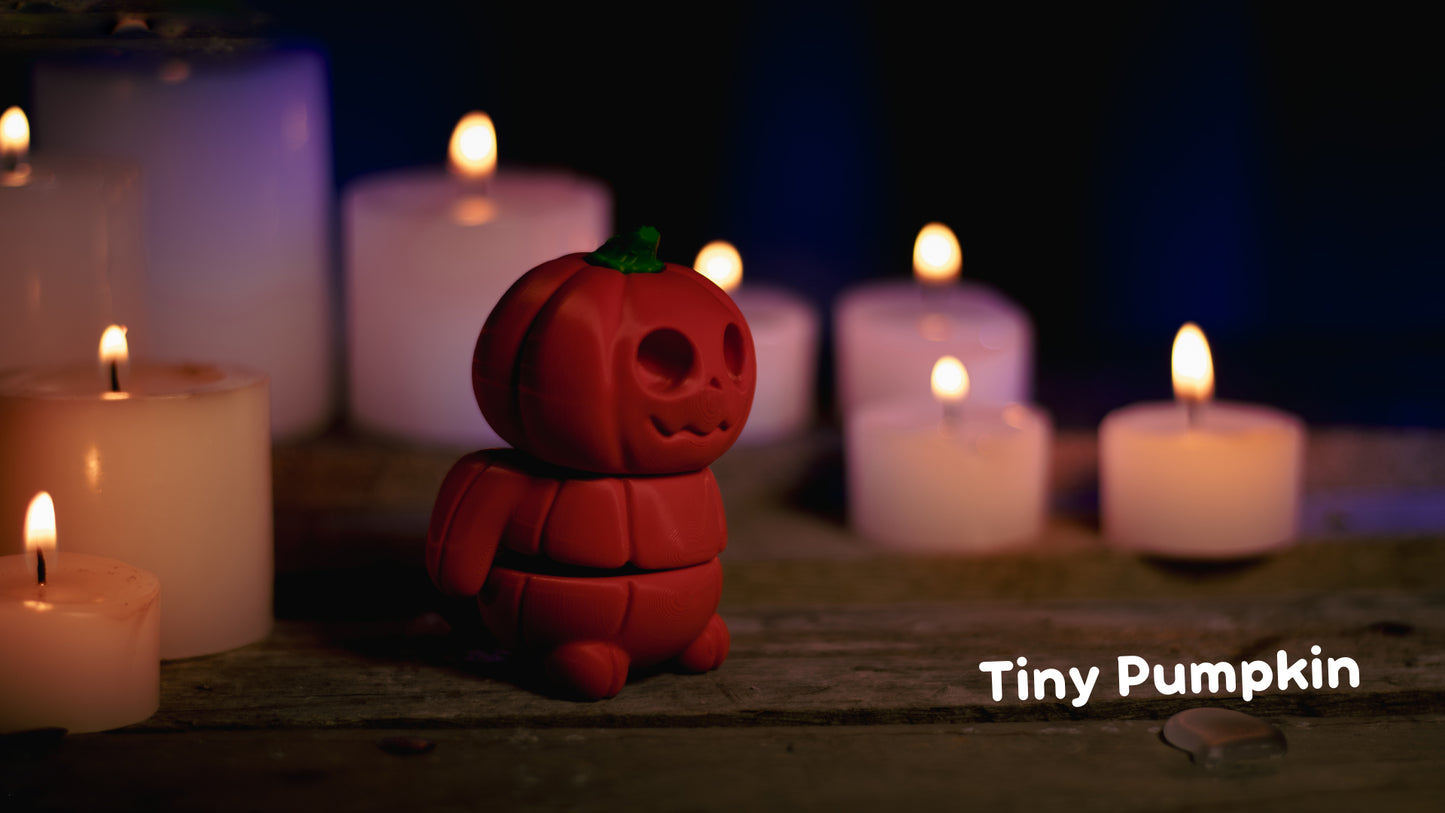 a red toy sitting next to a bunch of lit candles