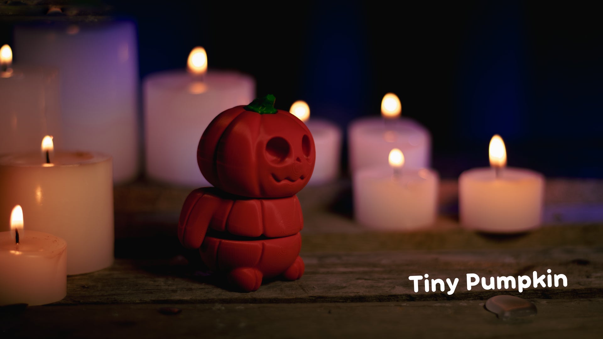 a red toy sitting next to a bunch of lit candles