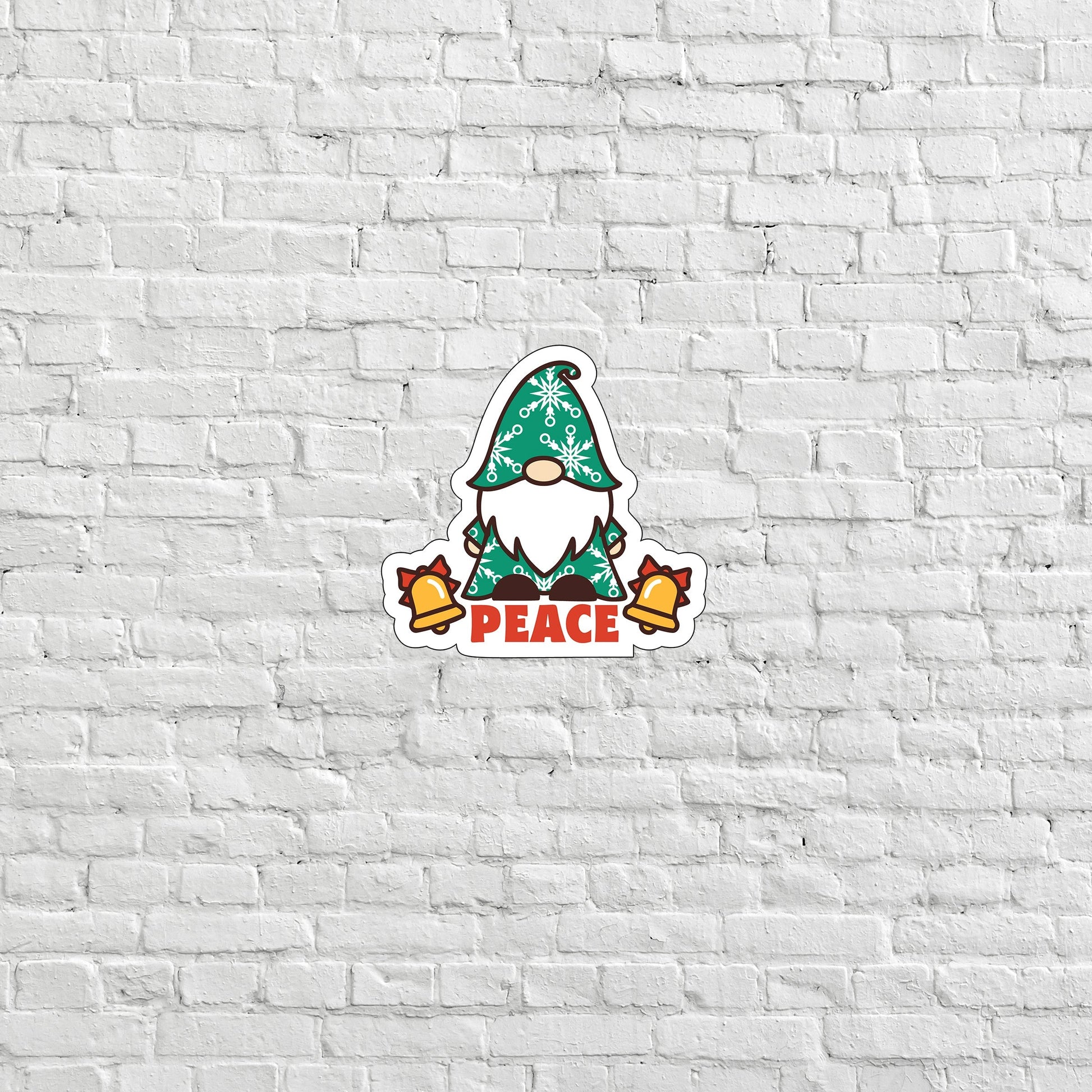 a white brick wall with a green gnome sticker on it