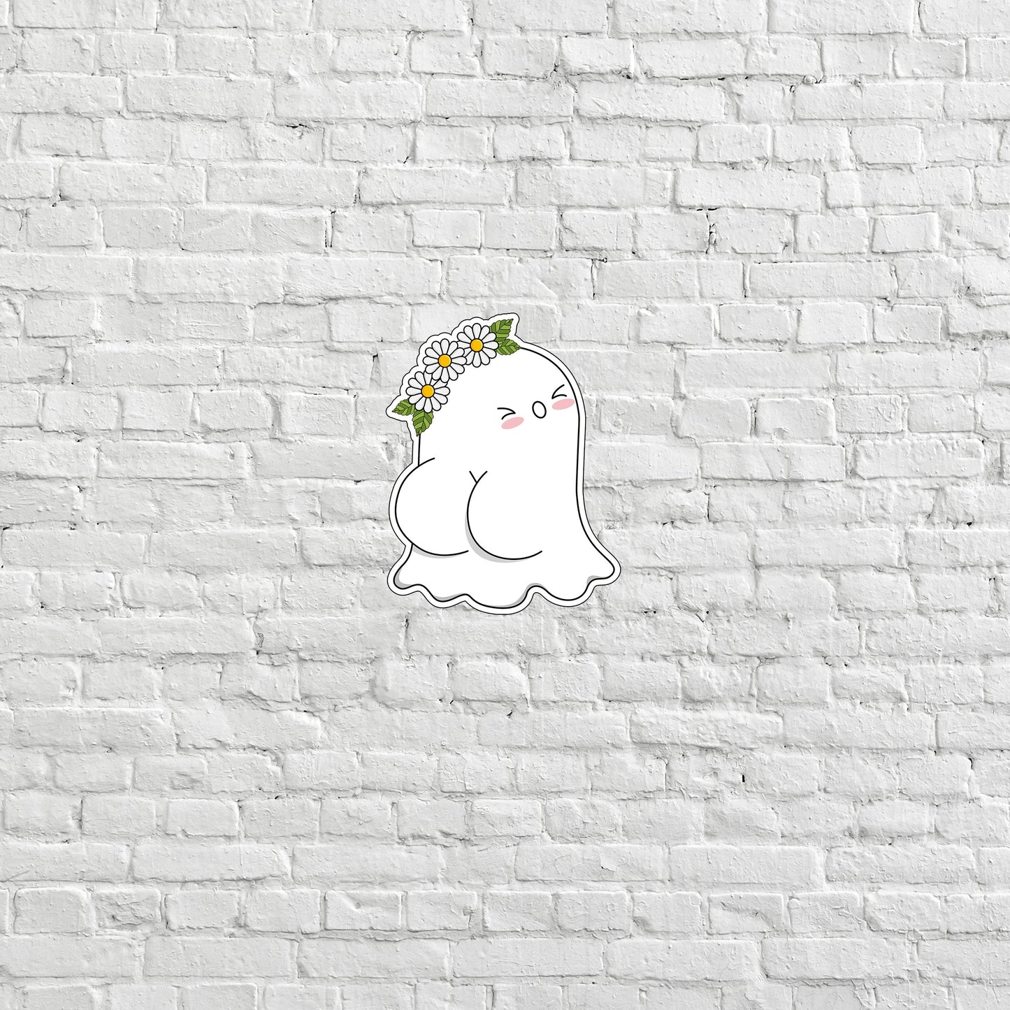 a white brick wall with a sticker of a cat with a flower crown on