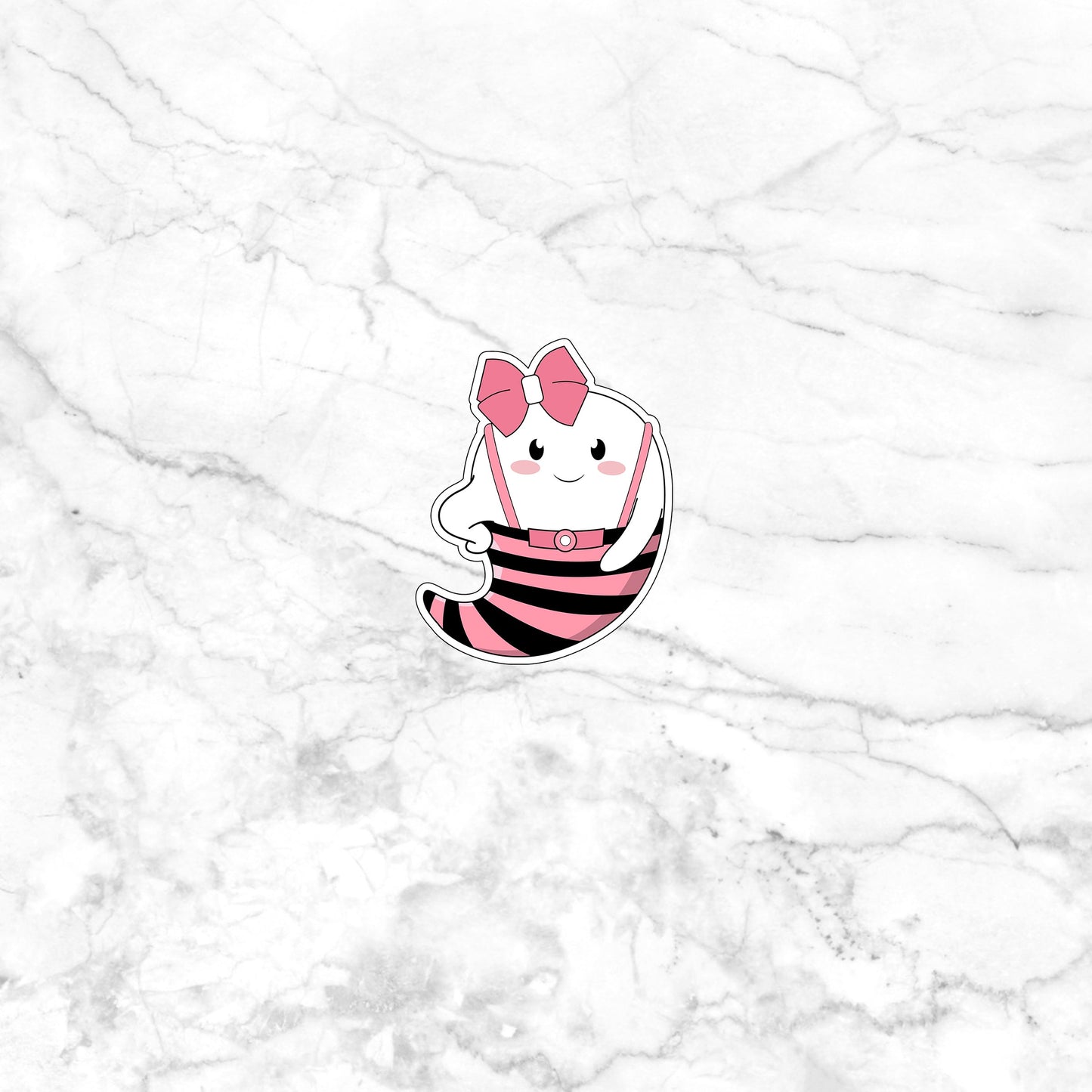 a white marble wall with a pink and black cat sticker on it