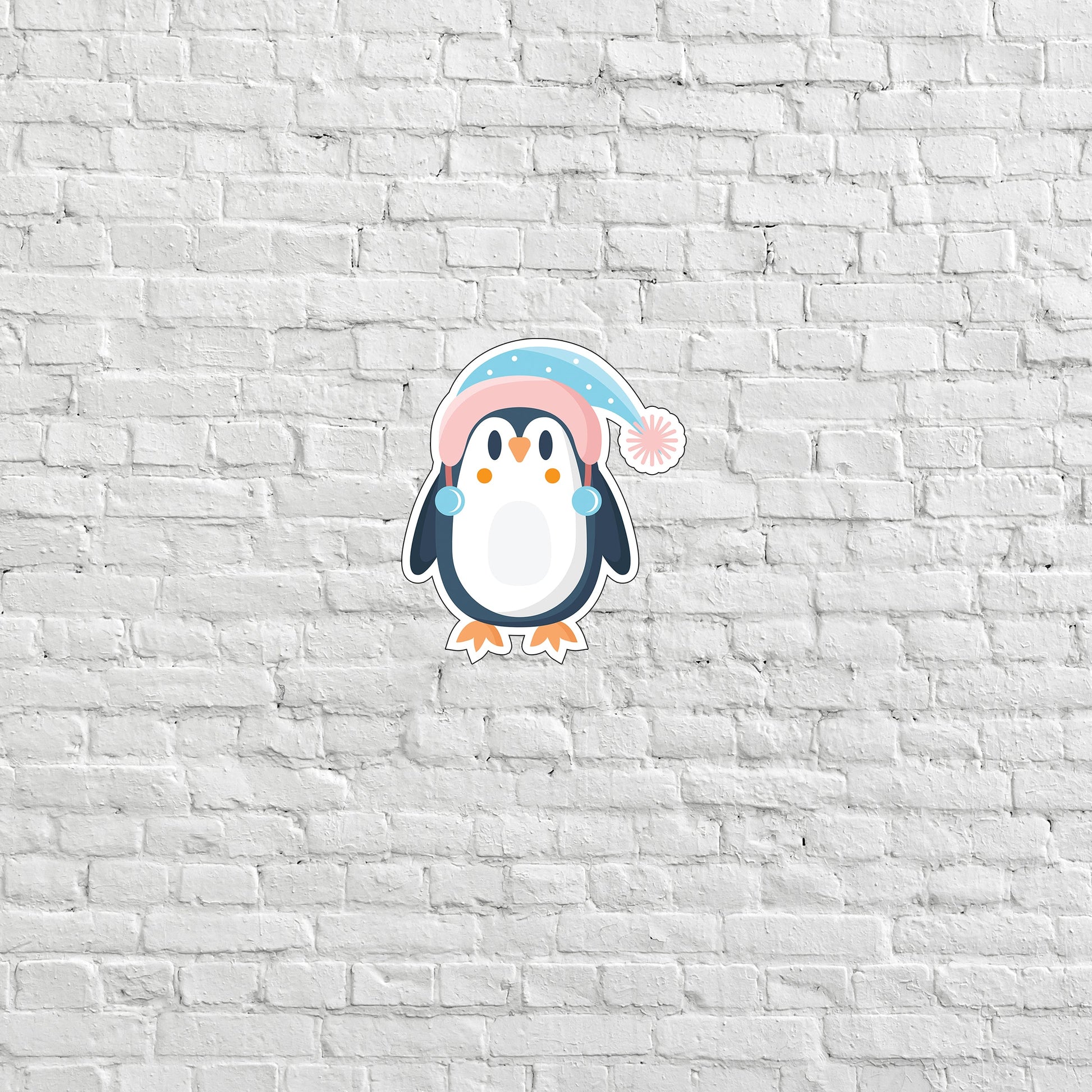 a penguin with a pink hat on a white brick wall