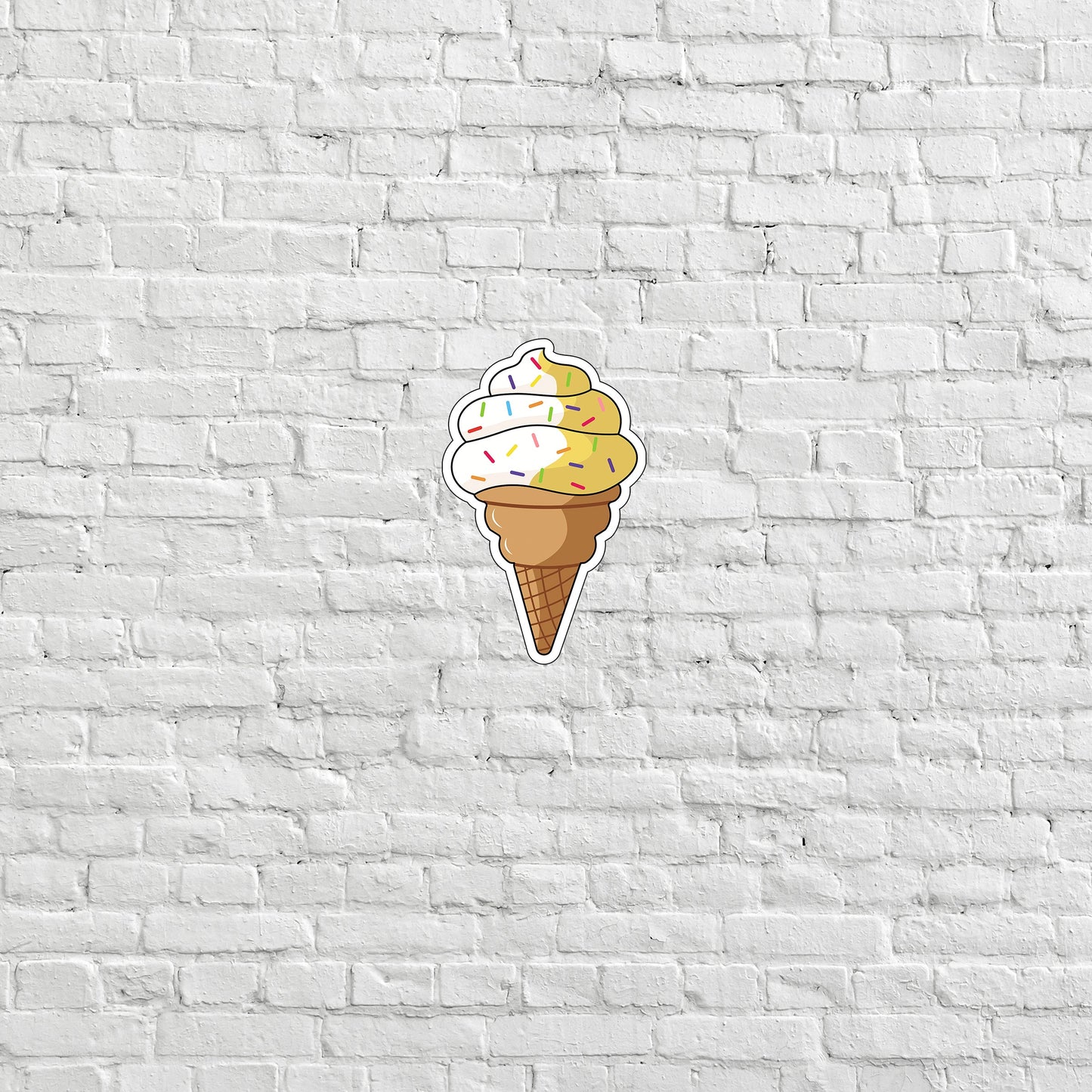 a sticker of a ice cream cone on a white brick wall