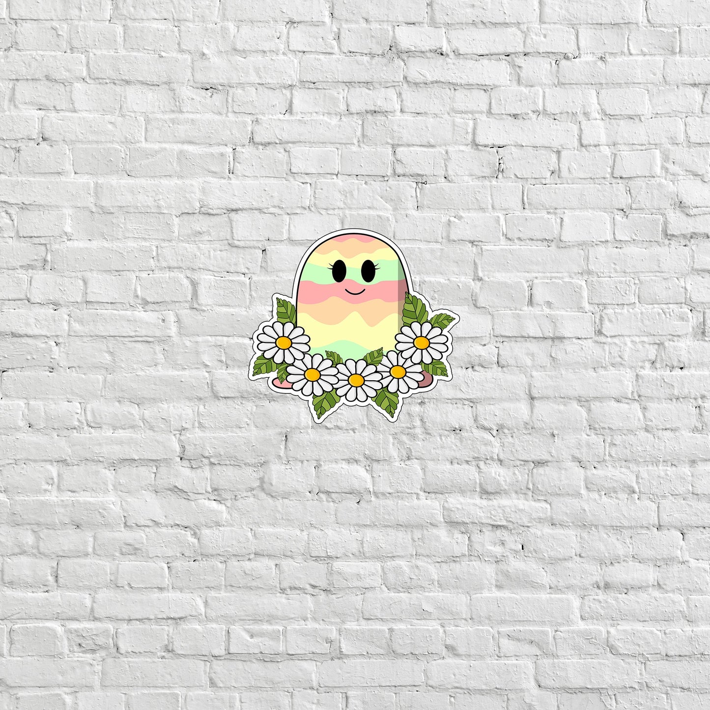 a white brick wall with a sticker of a bird and daisies