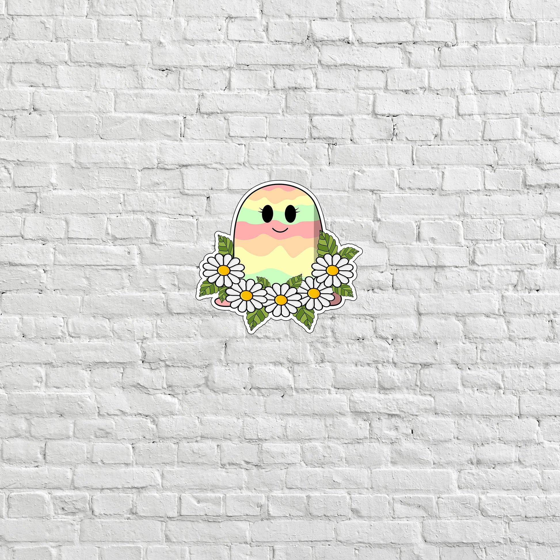 a white brick wall with a sticker of a bird and daisies