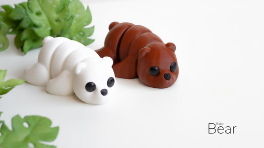 a close up of two small plastic animals