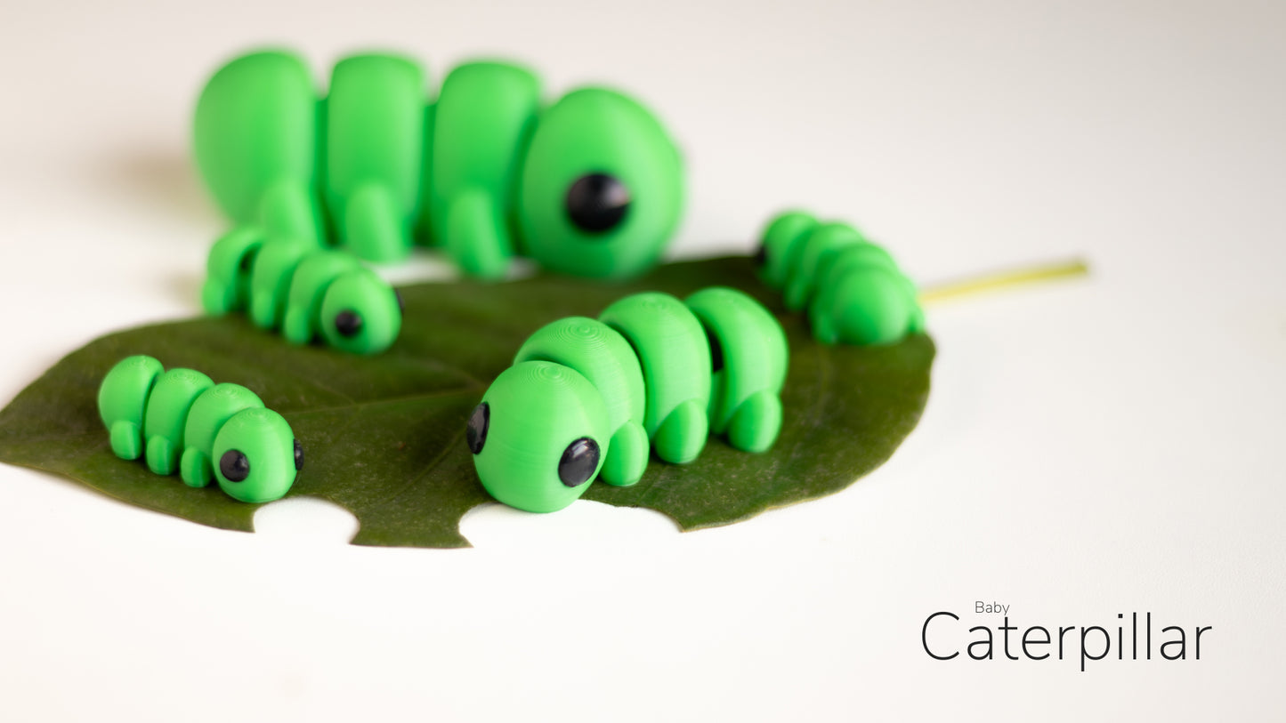 a group of green caterpillars sitting on top of a green leaf