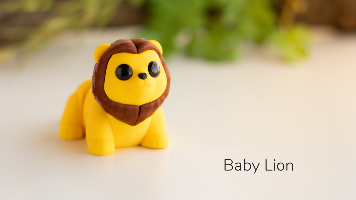 a toy lion sitting on top of a white table