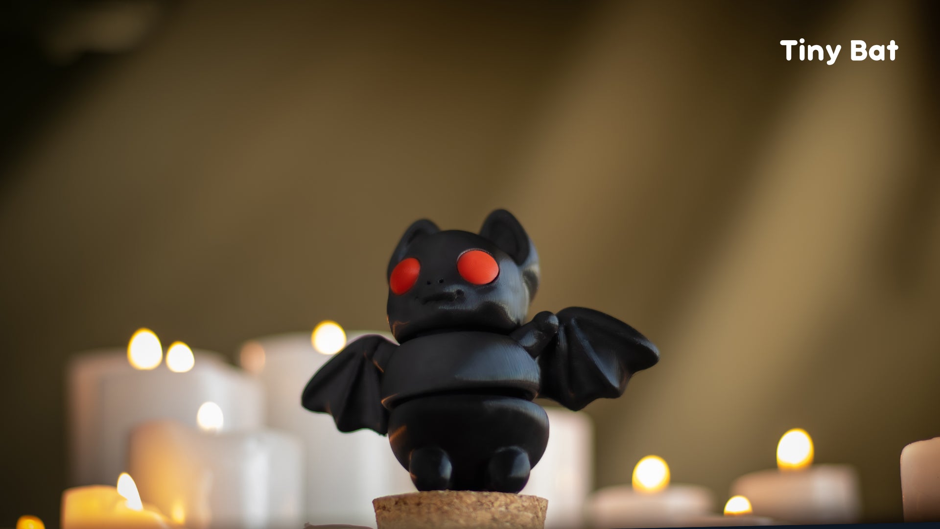 a small toy bat sitting on top of a table