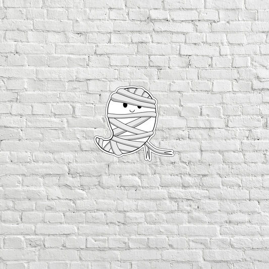 a drawing of a wrapped up ball of yarn on a brick wall