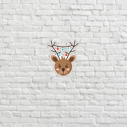 a white brick wall with a deer head on it