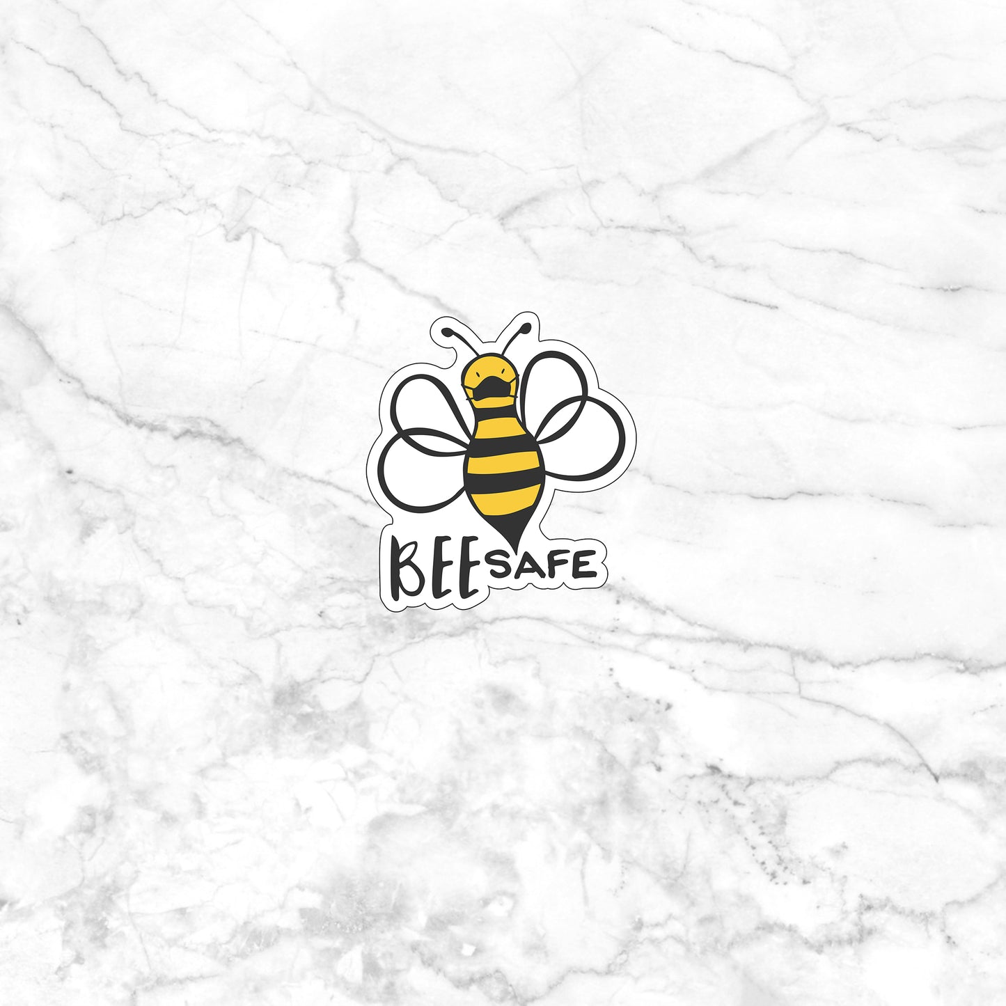 a white marble wall with a bee sticker on it