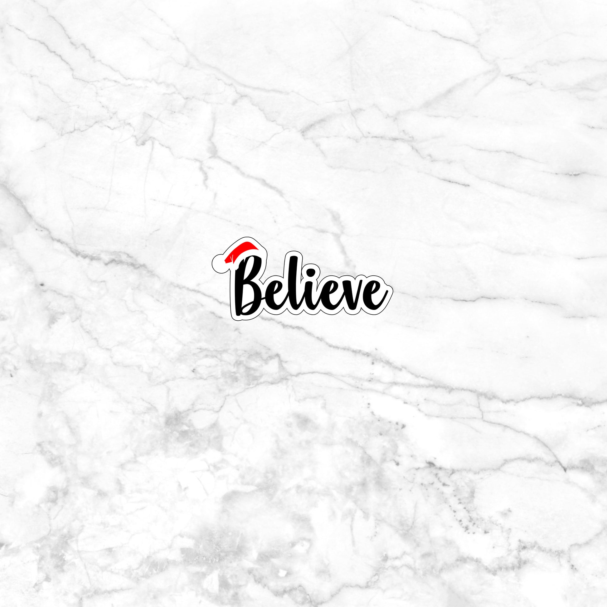 a white marble wall with the word believe on it