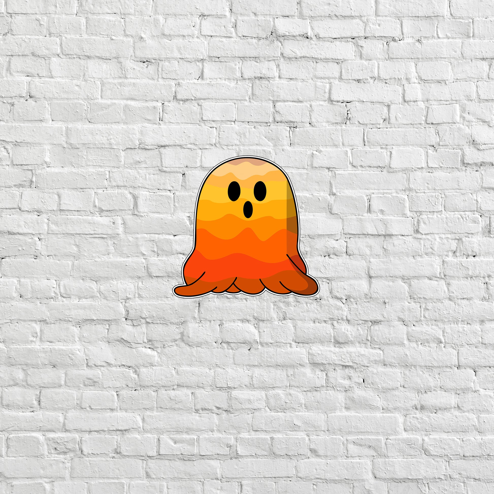 a ghost sticker on a white brick wall