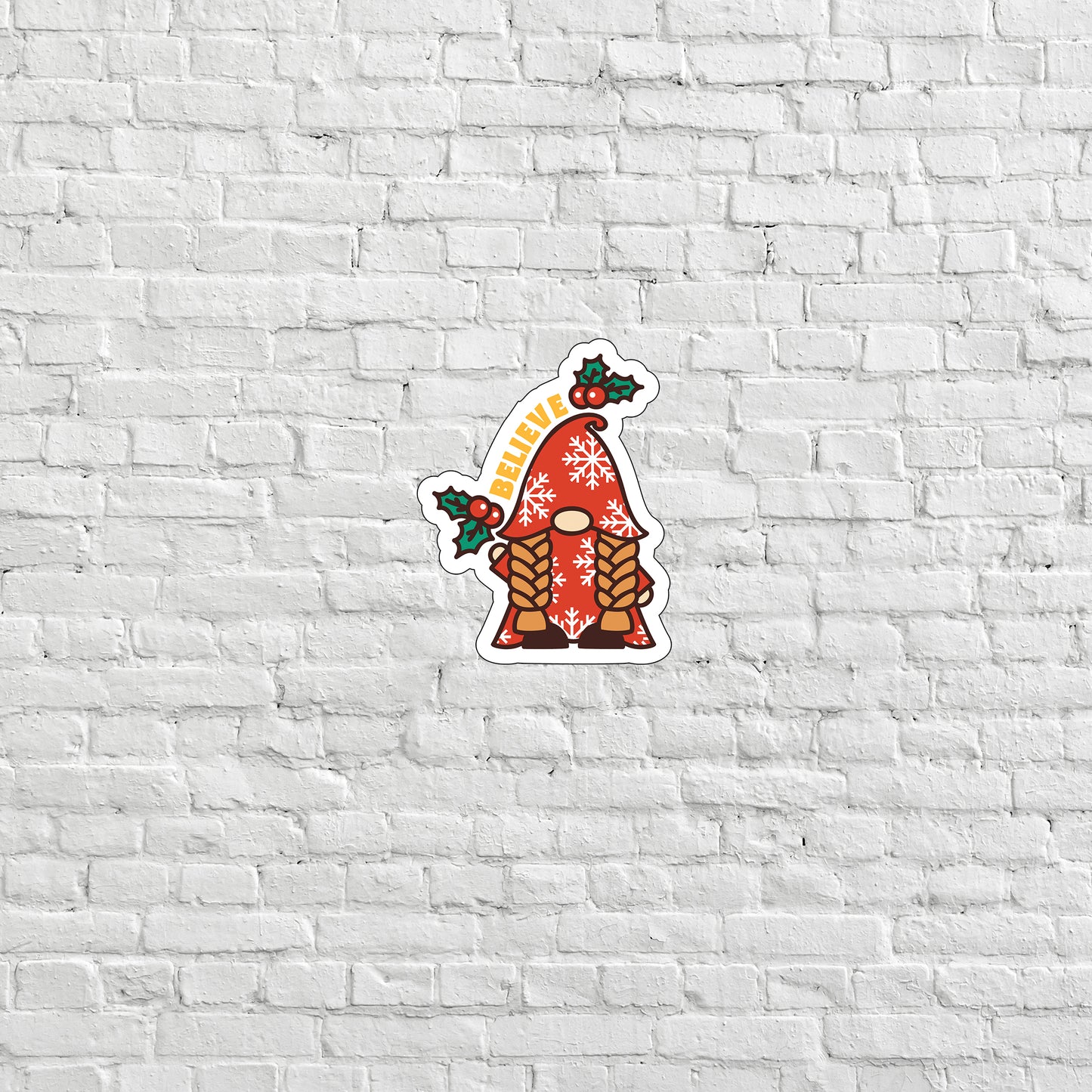 a brick wall with a sticker of a gnome