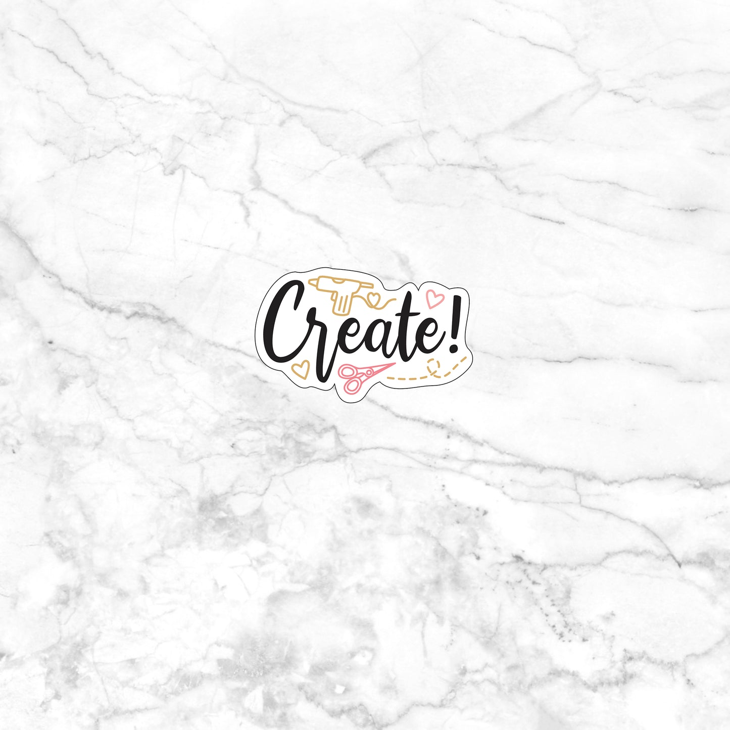 a white marble wall with a sticker that says create