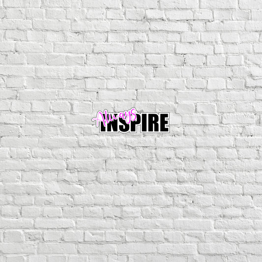 a white brick wall with the word inspire painted on it