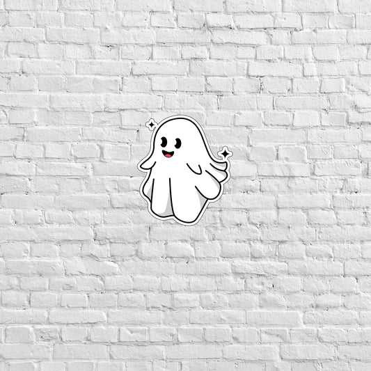 a white brick wall with a ghost sticker on it