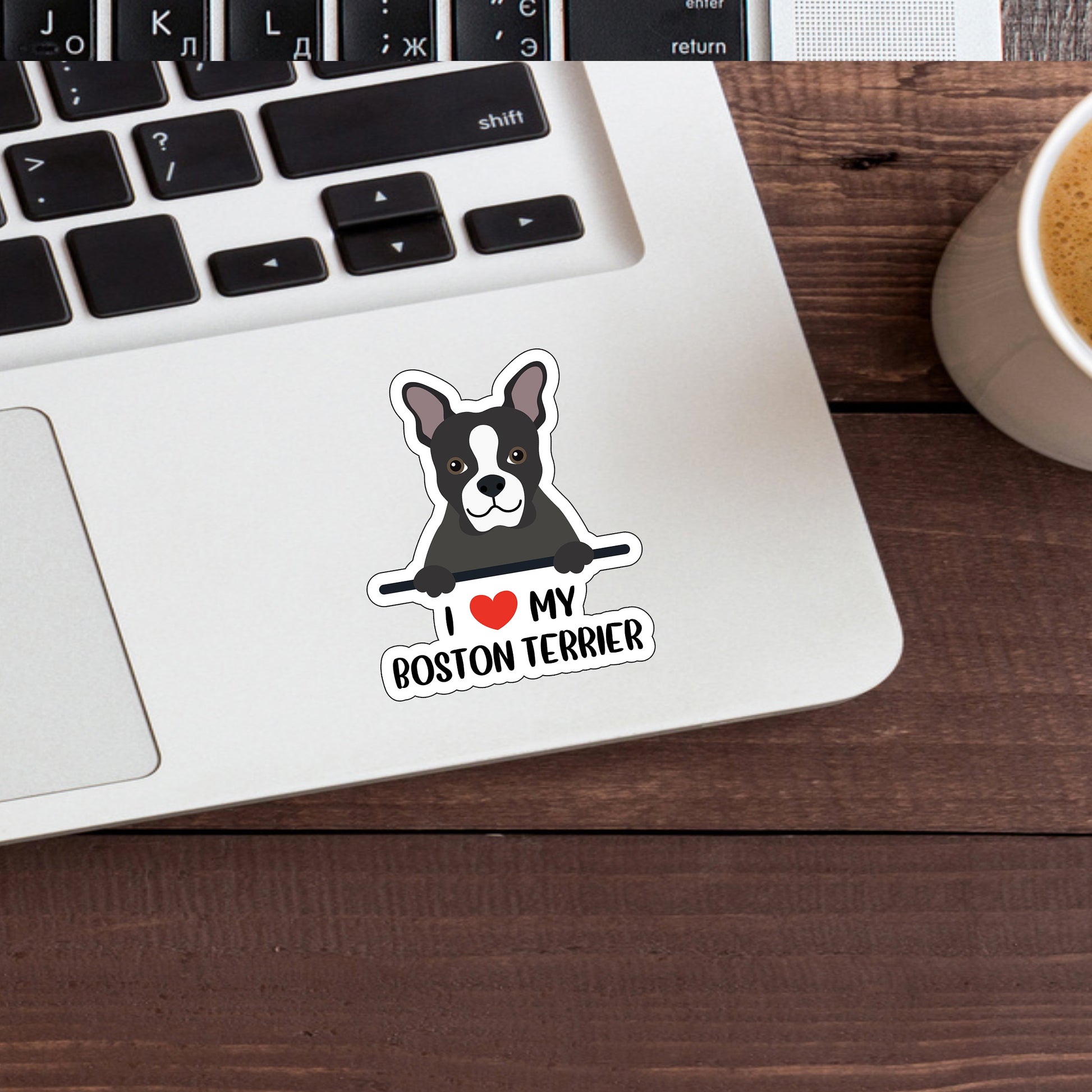 a sticker of a boston terrier on a laptop