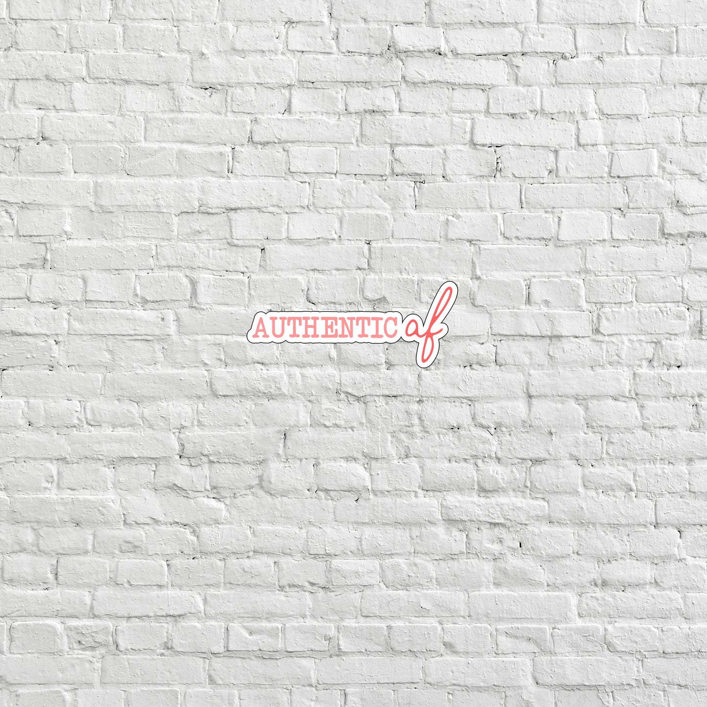 a white brick wall with the word authentic on it