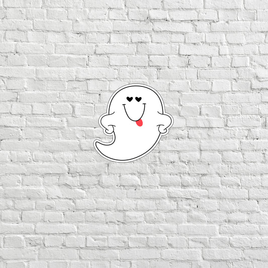 a white brick wall with a ghost sticker on it