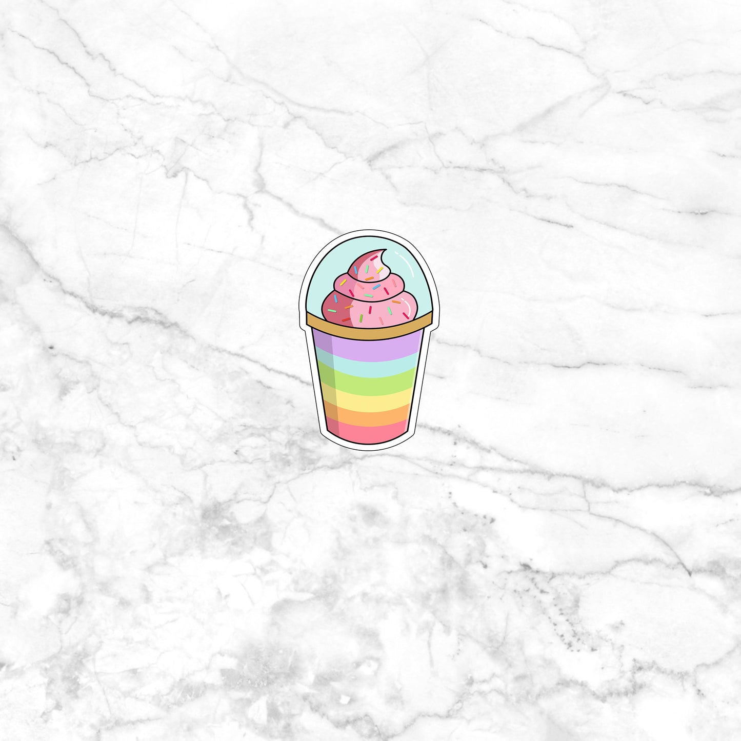 a cupcake sticker on a marble surface