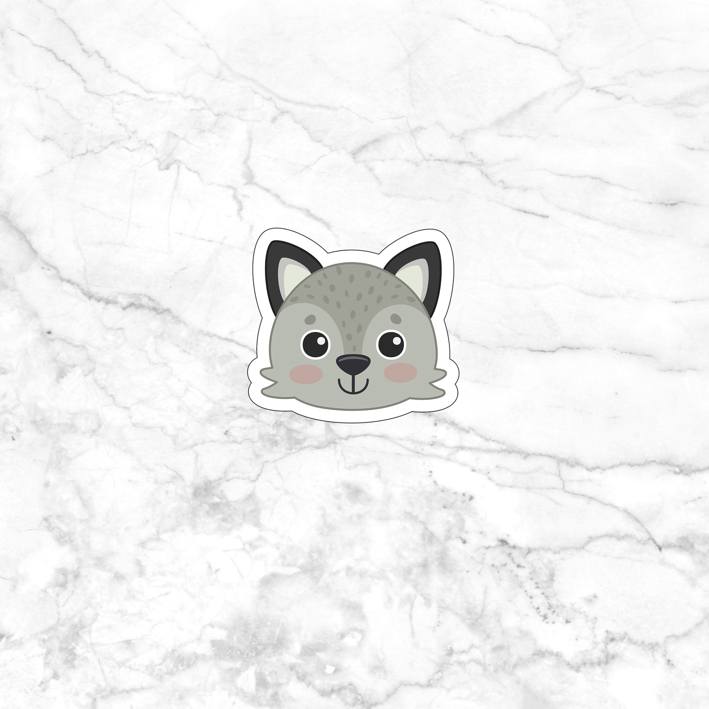 a sticker of a cat on a marble surface