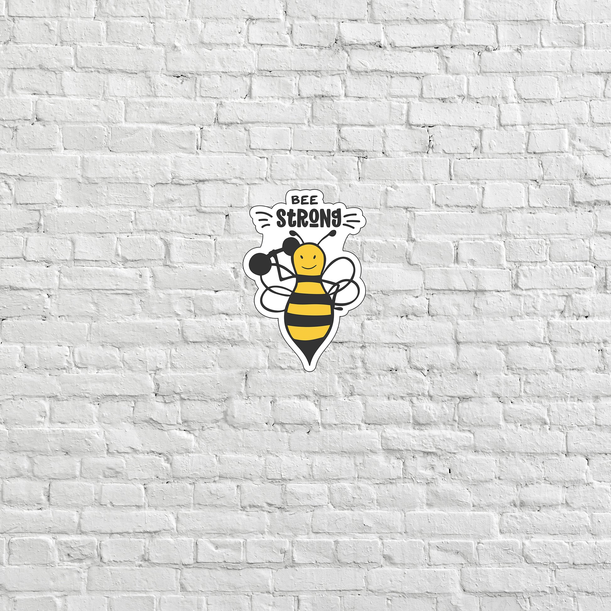 a white brick wall with a bee on it