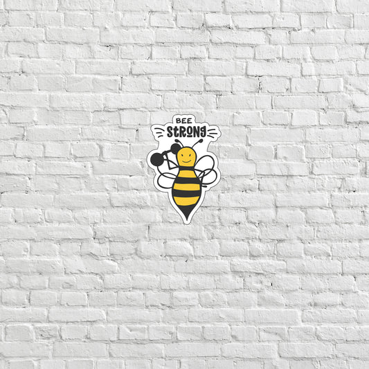 a white brick wall with a bee on it