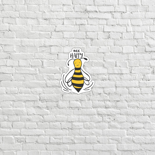 a white brick wall with a bee sticker on it