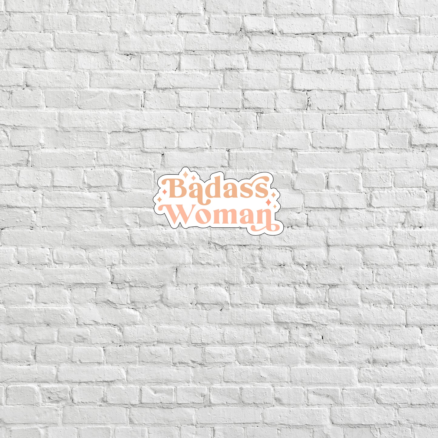 a brick wall with the words badass woman on it