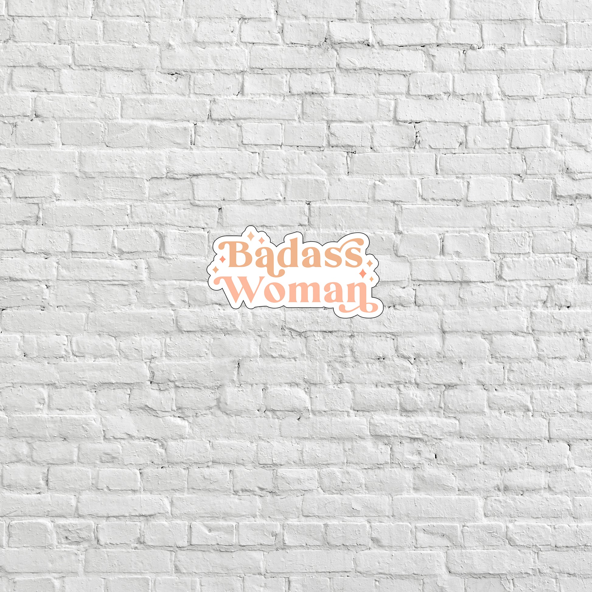 a brick wall with the words badass woman on it